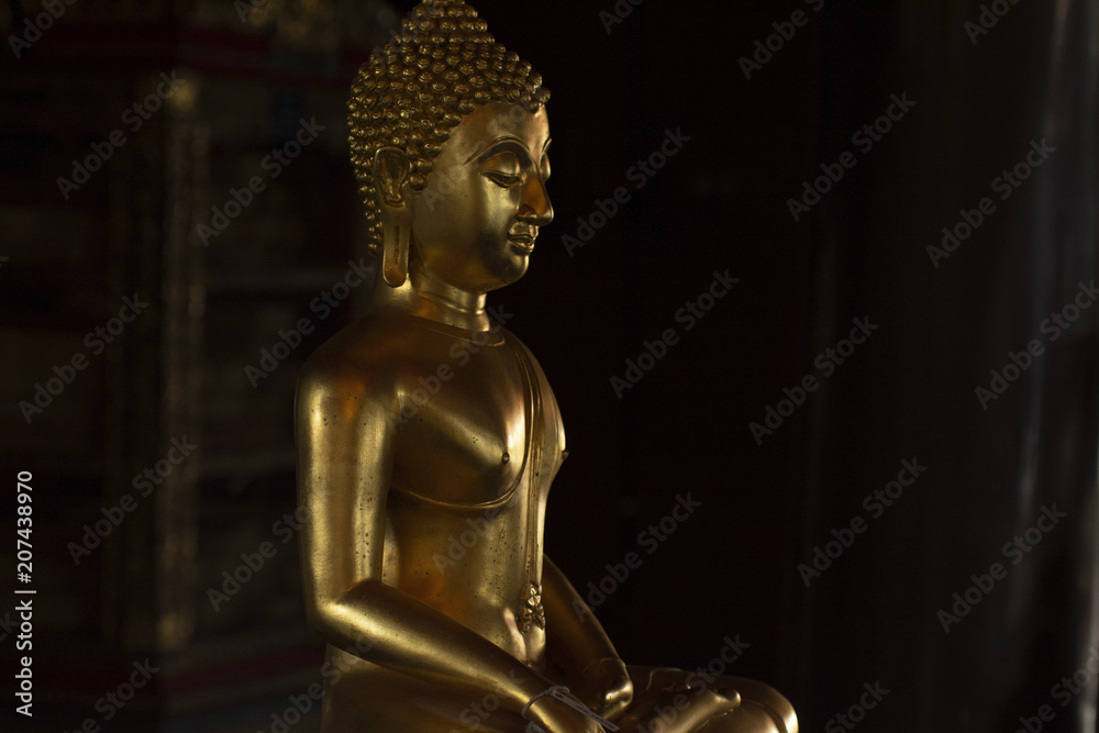 Golden Buddha images in different attitudes sculpture at Wat Krathum Suea Pla temple ,Bangkok