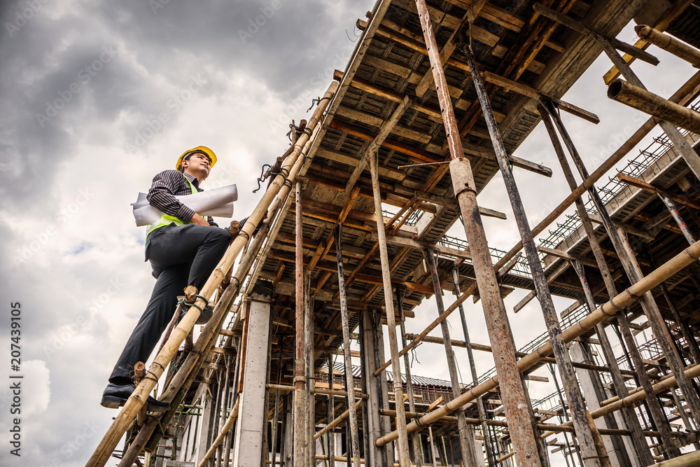 professional engineer worker at the house building construction site professional engineer worker at the house building construction site