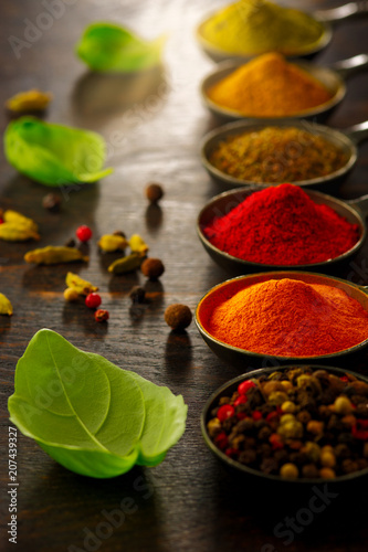 Fototapeta Naklejka Na Ścianę i Meble -  Wooden table of colorful spices