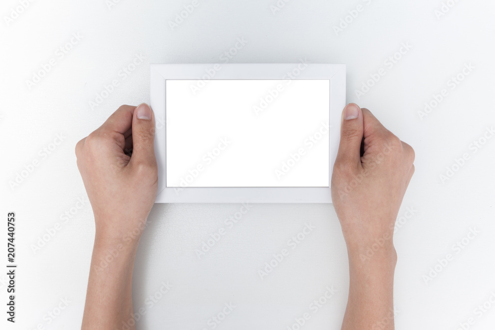Hand holding empty photo frame for mock up Hand holding empty photo frame for mock up