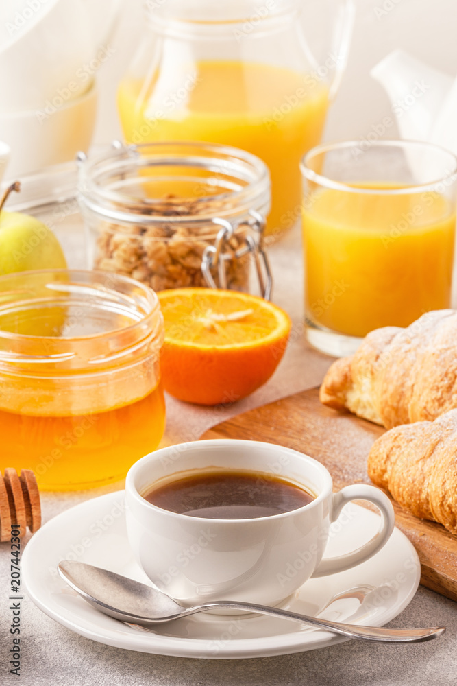 Continental breakfast with fresh croissants, orange juice and coffee Continental breakfast with fresh croissants, orange juice and coffee