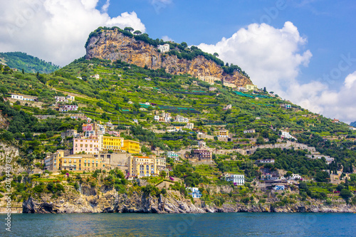Small town of Amalfi village with colorful houses, located on rock, Amalfi Mediterranean coast with Gulf of Salerno, Campania, Italy.