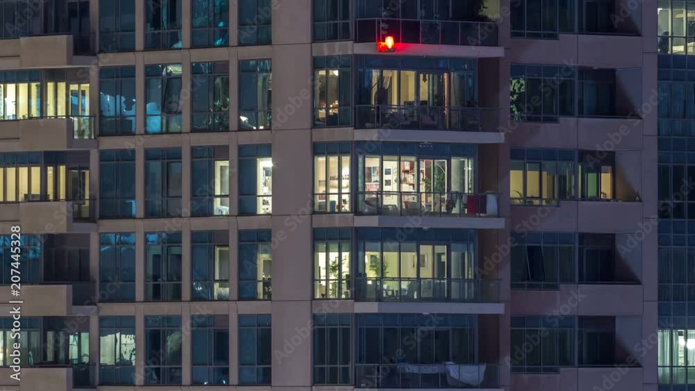 Glowing windows of skyscrapers at evening timelapse Glowing windows of skyscrapers at evening timelapse
