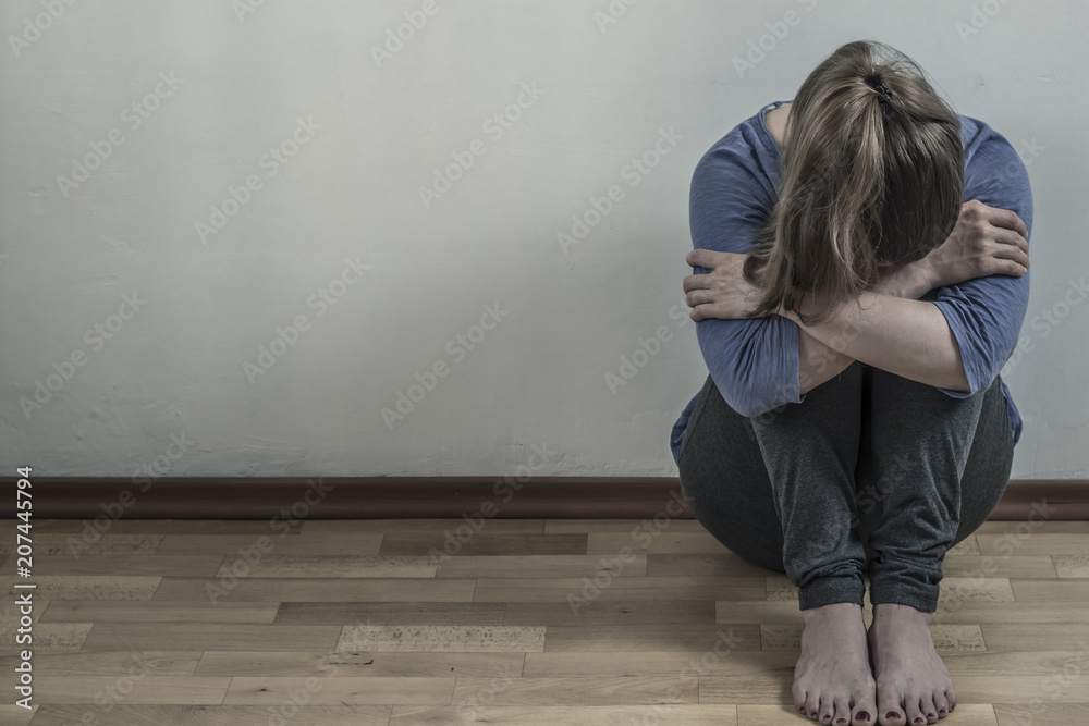 Depressed with a woman. The girl is sad in the room. Depressed with a woman. The girl is sad in the room.