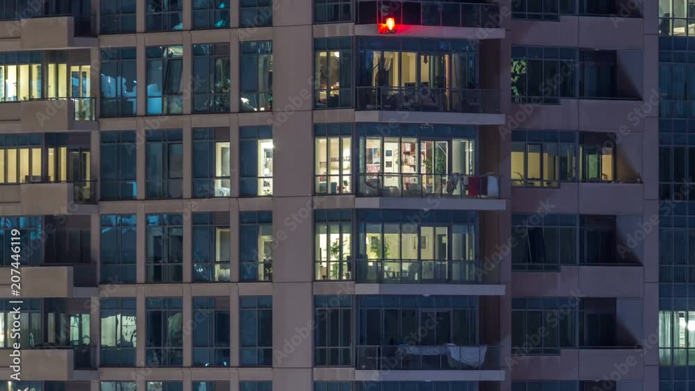 Glowing windows of skyscrapers at evening timelapse Glowing windows of skyscrapers at evening timelapse