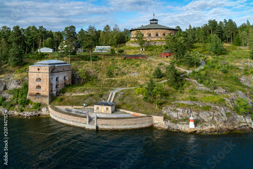 Historic fortress and guard tower on island in archipelago, off Stockholm, Sweden photo