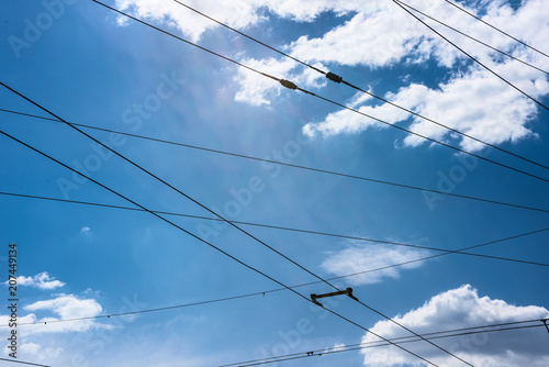Trolleybus wires and sky with clouds