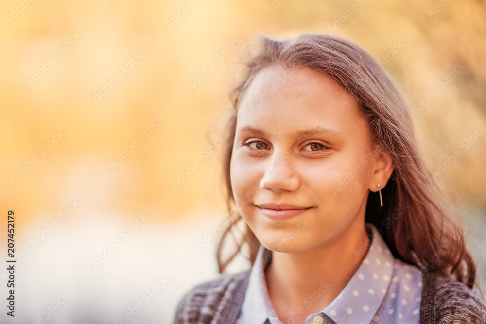 Portrait of a beautiful smiling girl with beautiful long hair in spring garden. Portrait of a beautiful smiling girl with beautiful long hair in spring garden.