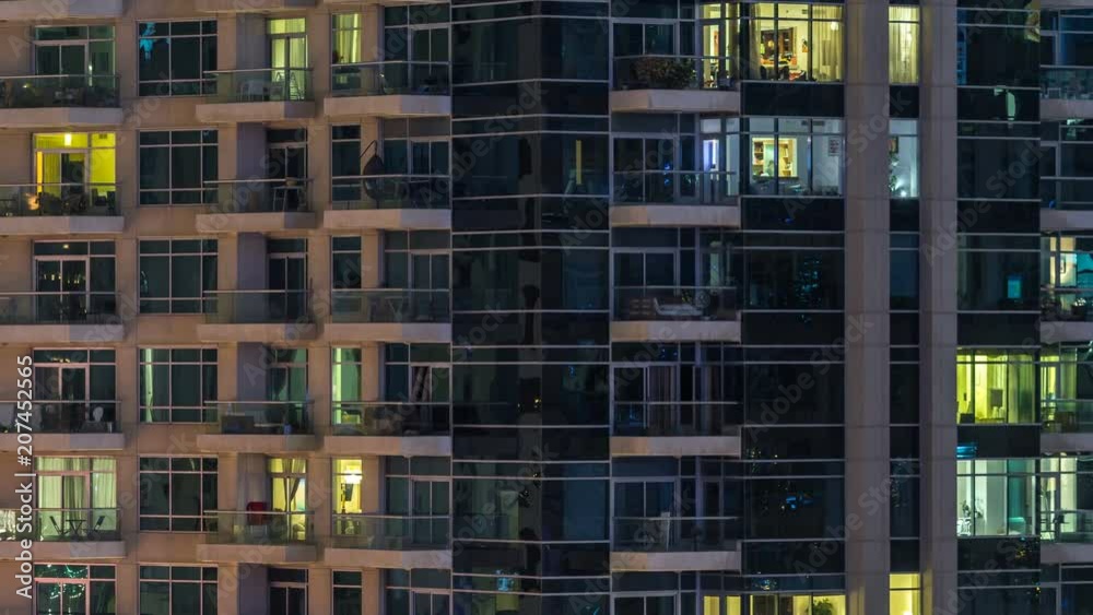 Glowing windows of skyscrapers at evening timelapse Glowing windows of skyscrapers at evening timelapse