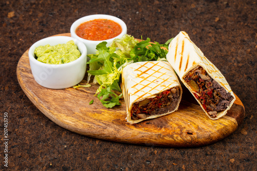 Delicious burito with sauce