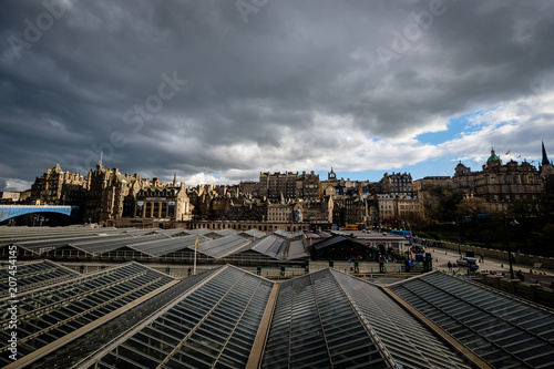View of Edinburghs Market Street as seen from Waverly Station, with the stations glass ceiling in the foreground. Edinburgh, Scotland photo