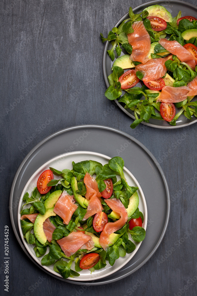 Fresh salad made of salmon, tomatoes and avocado Fresh salad made of salmon, tomatoes and avocado