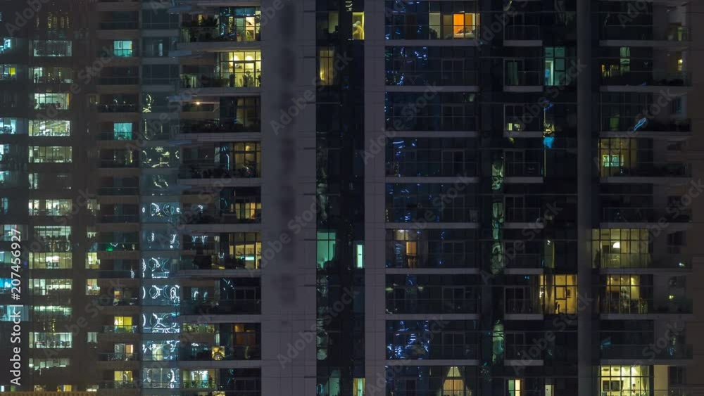 Glowing windows of skyscrapers at evening timelapse Glowing windows of skyscrapers at evening timelapse