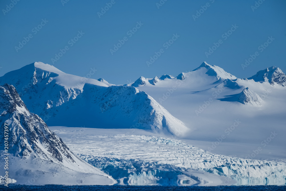 Fototapeta premium landscape ice nature of the glacier mountains of Spitsbergen Longyearbyen Svalbard arctic ocean winter polar day sunset sky