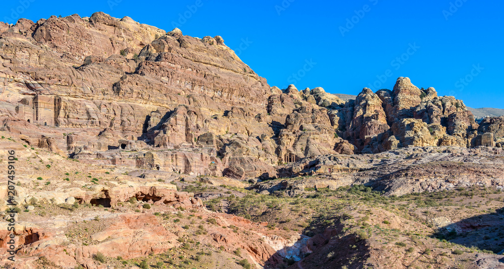 Fototapeta premium Old tombs at sunset in Petra, Jordan