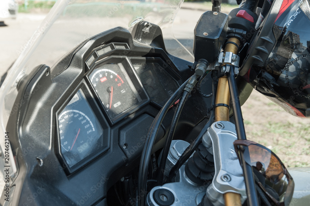 Fototapeta premium three part, red color dashboard of the car and kilometer gauge.