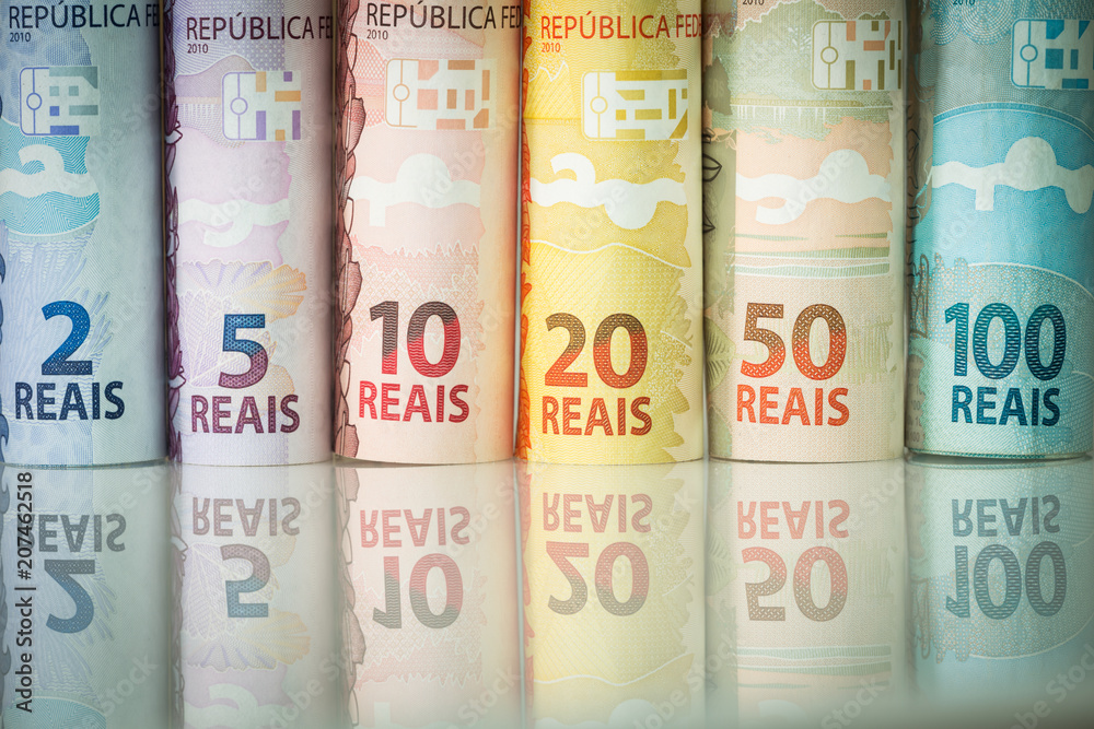 Brazilian money reflecting in the white glass Brazilian money reflecting in the white glass