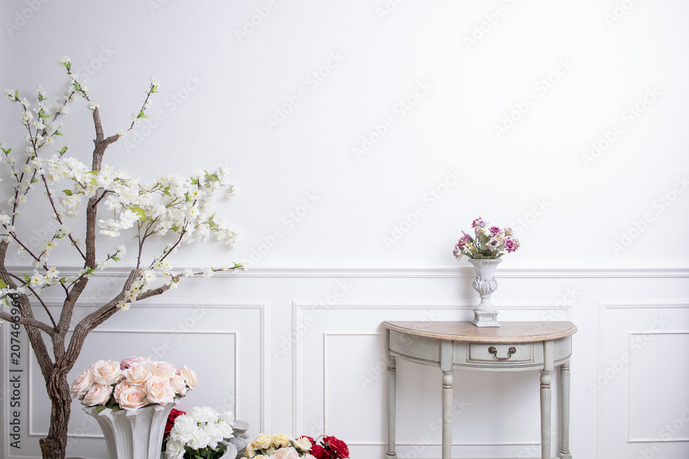 Elegant interior decoration with flowers on  white wedding background