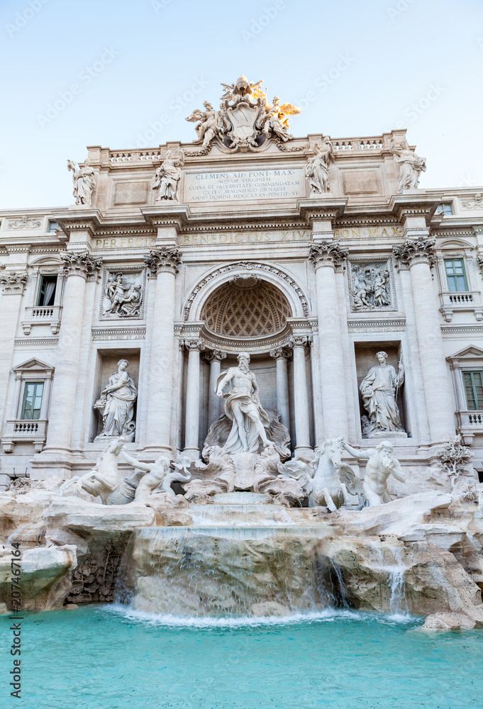Trevi fountain at sunrise, Rome, Italy. Rome baroque architecture and landmark. Rome Trevi fountain is one of the main attractions of Rome and Italy. Panorama. Panoramic view