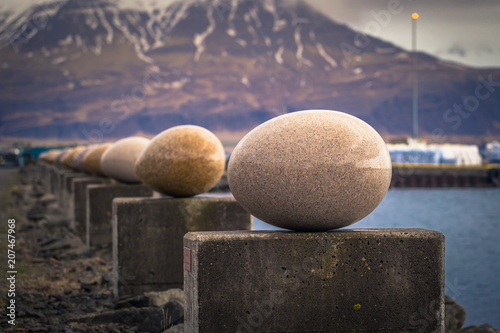 Djupivogur - May 06, 2018: Egg statues in the harbor of Djupivogur, Iceland photo