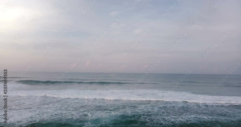 Aerial drone view of high waves in beautiful sunset ocean. Breathtaking open ocean, cloudy sky and horizon panorama. Aerial drone view of high waves in beautiful sunset ocean. Breathtaking open ocean, cloudy sky and horizon panorama.