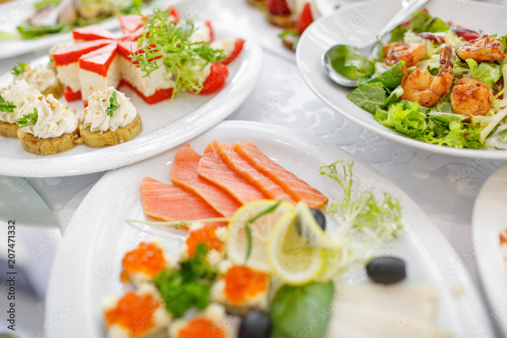 catering table set service with silverware and glass stemware at catering table set service with silverware and glass stemware at
