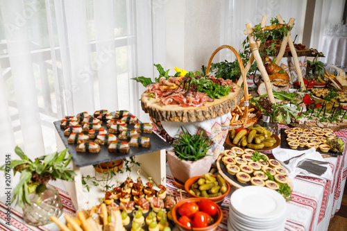 Beautifully decorated catering banquet table with different food