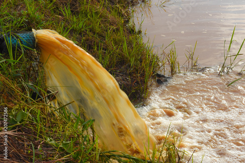 Water is polluted by turbid odors from industrial plants. Not therapy It was drained from the pipeline into the public water. Destroying the environment photo