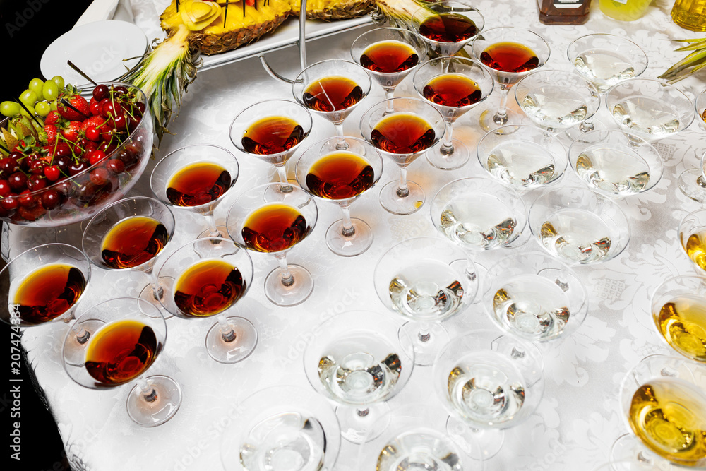 Many glasses of colorful Cocktails on the table Many glasses of colorful Cocktails on the table