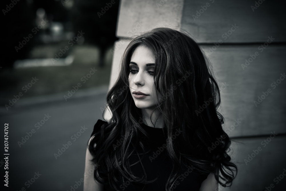 Gothic young brunette woman outdoors, shallow depth of field Gothic young brunette woman outdoors, shallow depth of field