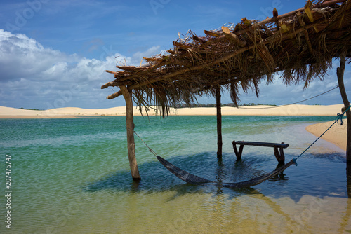 A hammock in a lagoon in Pequenos Lençois, Lençois Maranhenses, Maranhao, Brazil. Between Barreirinhas and Cabure. photo