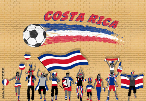 Costa Rican football fans cheering with Costa Rica flag colors in front of soccer ball graffiti