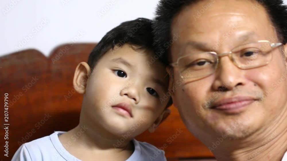 Thai child playing with his father, chiangmai Thailand Thai child playing with his father, chiangmai Thailand