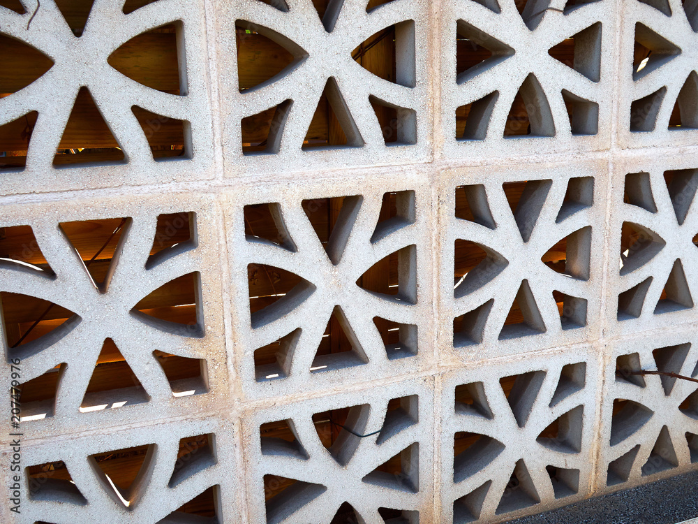 Patterned geometric fence made of stone