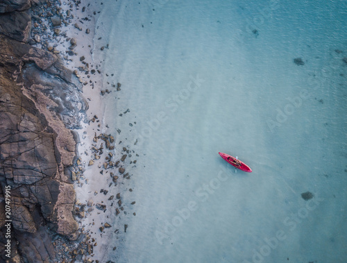 Ocean Kayaing Near Rocky Coastline
