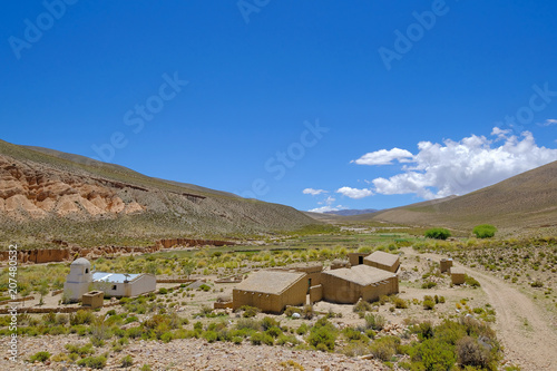 Village with adobe houses and white church in the highlands of northern Argentina, Province Jujuy, South America