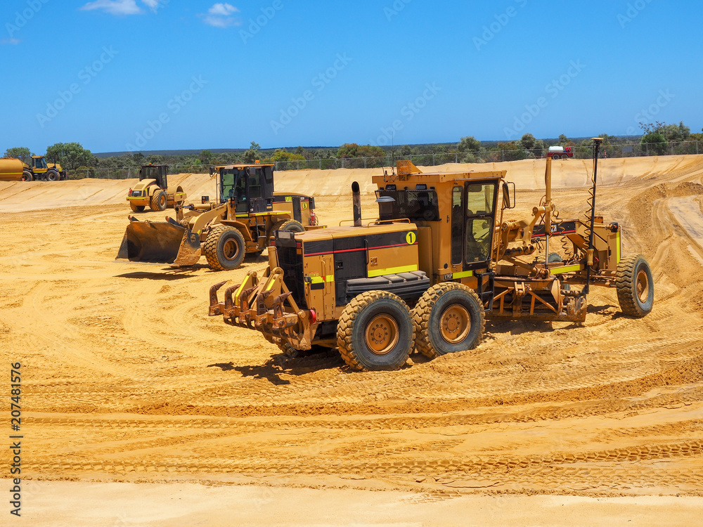 Heavy machineries working on large construction site Heavy machineries working on large construction site