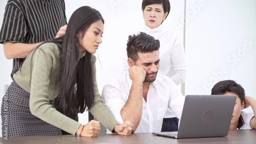 Losing business team. Asian businessman and woman with indian man looking at laptop and shouting for big loss and upset. Fail start ups concept.