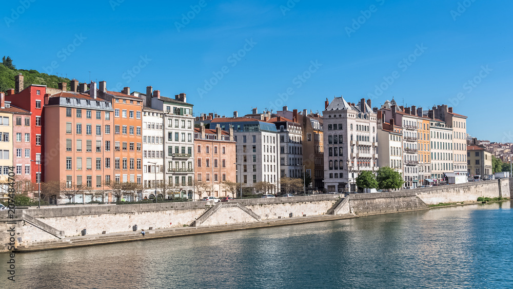 Vieux-Lyon, beautiful facades on the quay, colorful houses in the center, on the river Saone, panorama 
