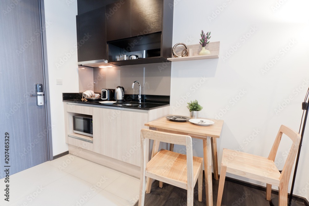 Fototapeta premium Dinning corner near kitchen. small kitchen counter ideas in the apartment.