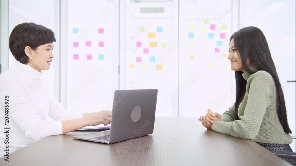 Young asian woman completed her job interview and got a job. Young career concept. Young asian woman completed her job interview and got a job. Young career concept.