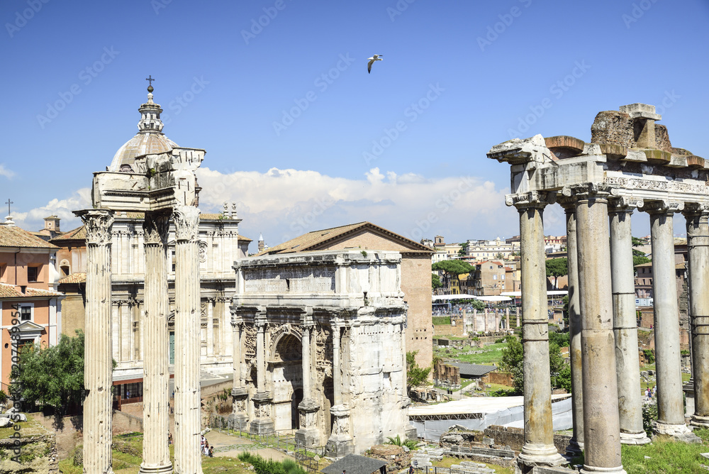 Rome,  ruins of the Imperial forums of ancient Rome. Arch of Septimius Severus and Temple of Saturn