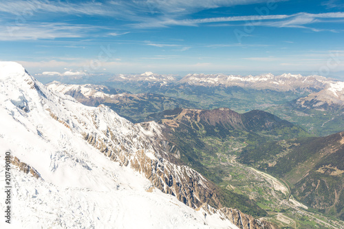view on mountain valley in Chamonix from Aiguille du Midi peak