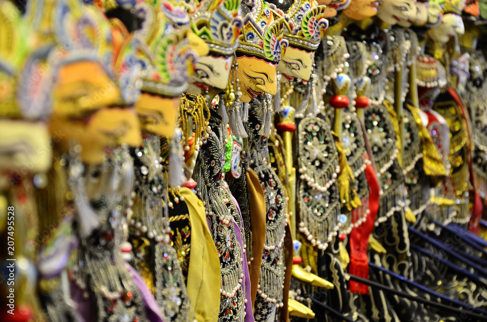 Naklejka premium Traditional ancient Javanese Indonesian wooden puppets toys man male woman female uniforms hat face