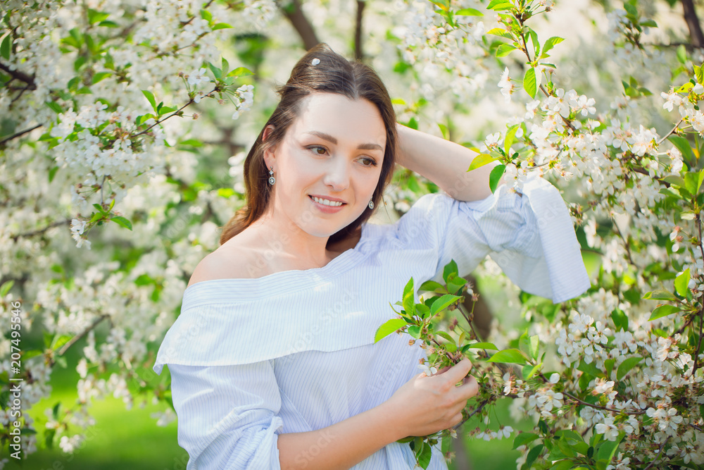 Close up romantic portrait of beautiful elegant woman in blossom spring trees. Close up romantic portrait of beautiful elegant woman in blossom spring trees.