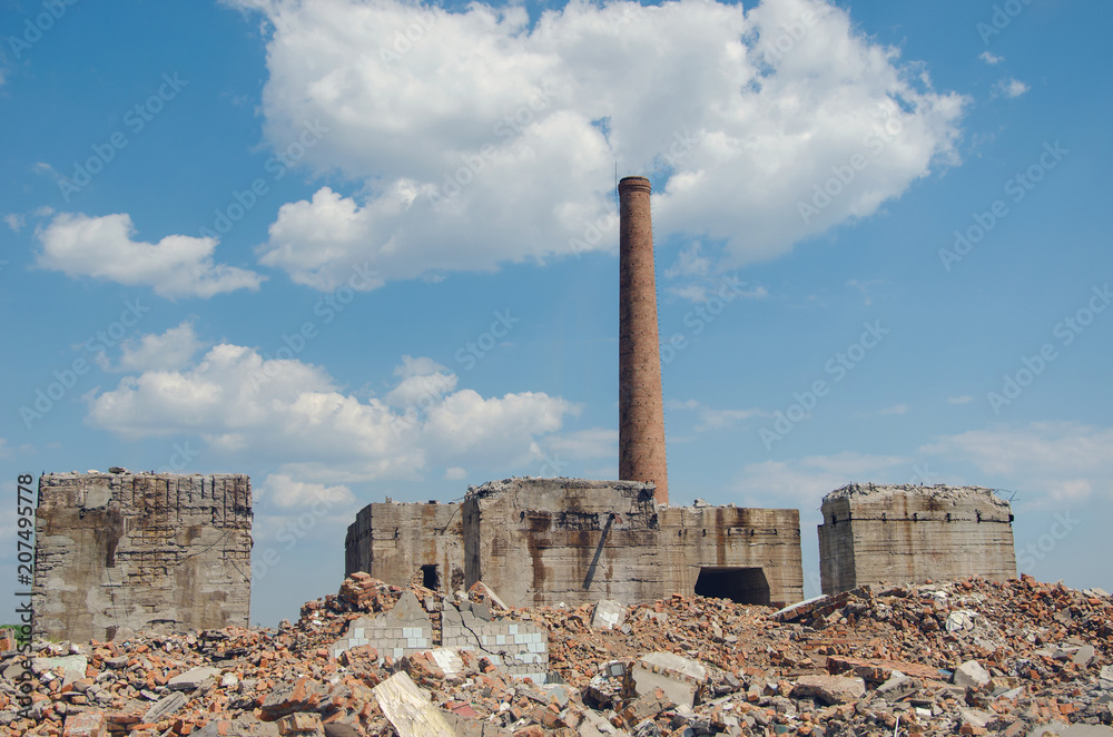the ruins of the old factory with surviving brick pipes