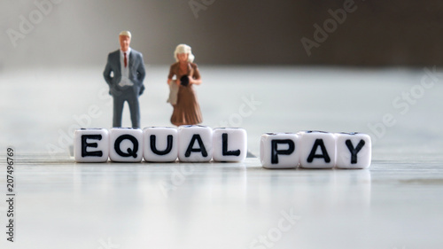 Equal pay text cube and miniatures.