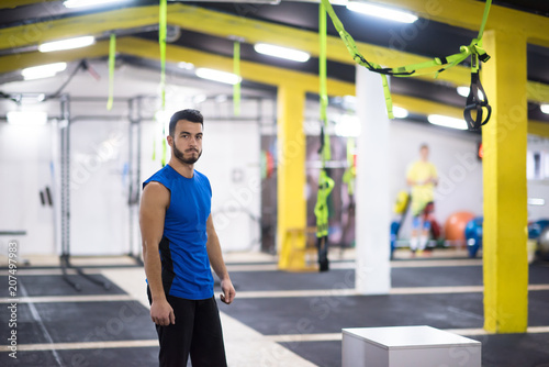 portrait of young man at cross fitness gym