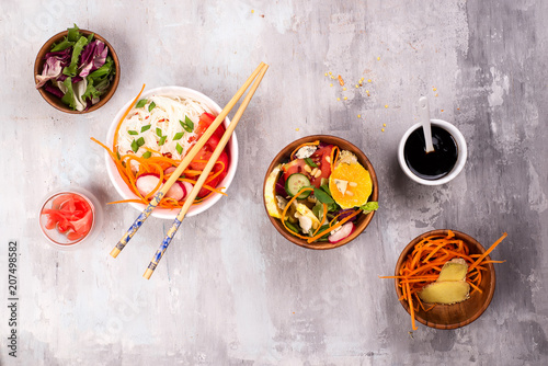 Spicy glass noodles with vegetables - carrots, cucumber, peppers, garlic.