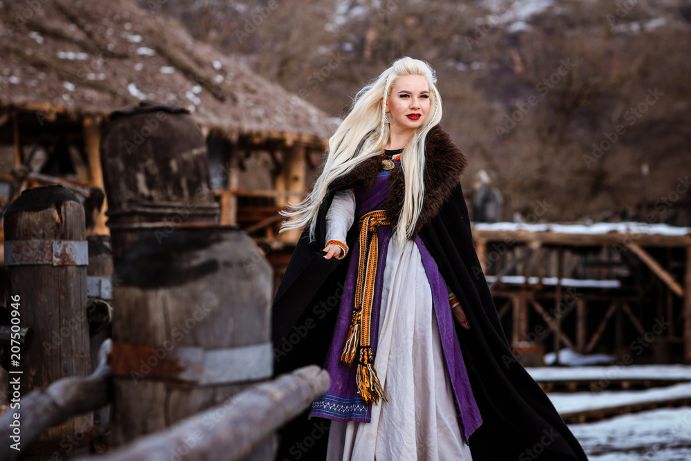 Beautiful young woman holding a viking with blond hair. Image of Historical figure Beautiful young woman holding a viking with blond hair. Image of Historical figure